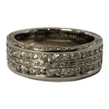 AN 18CT WHITE GOLD AND DIAMOND THREE ROW HALF ETERNITY RING Having pavé set round cut diamonds. (