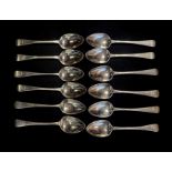 A MATCHED SET OF TWELVE GEORGIAN SILVER DESSERT SPOONS Plain form with engraved family crest of an