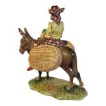 A RARE BESWICK POTTERY FIGURAL GROUP, A YOUNG JAMAICAN GIRL SITTING ON A DONKEY Titled ‘Susie