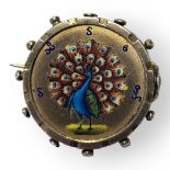 AN EARLY 20TH CENTURY BURMESE SILVER AND ENAMEL COIN BROOCH Hand enamelled decoration of a peacock