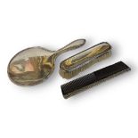 A MATCHED EARLY 20TH CENTURY SILVER DRESSING TABLE BRUSH AND COMB SET Comprising a hand mirror and