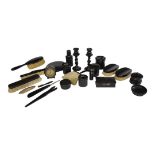 A LATE 19TH/EARLY 20TH CENTURY EBONY EXTENSIVE TWENTY-THREE PIECE LADIES’ DRESSING SET Comprising