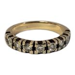 A YELLOW METAL AND DIAMOND HALF ETERNITY RING Having a row of round cut diamonds. (approx total