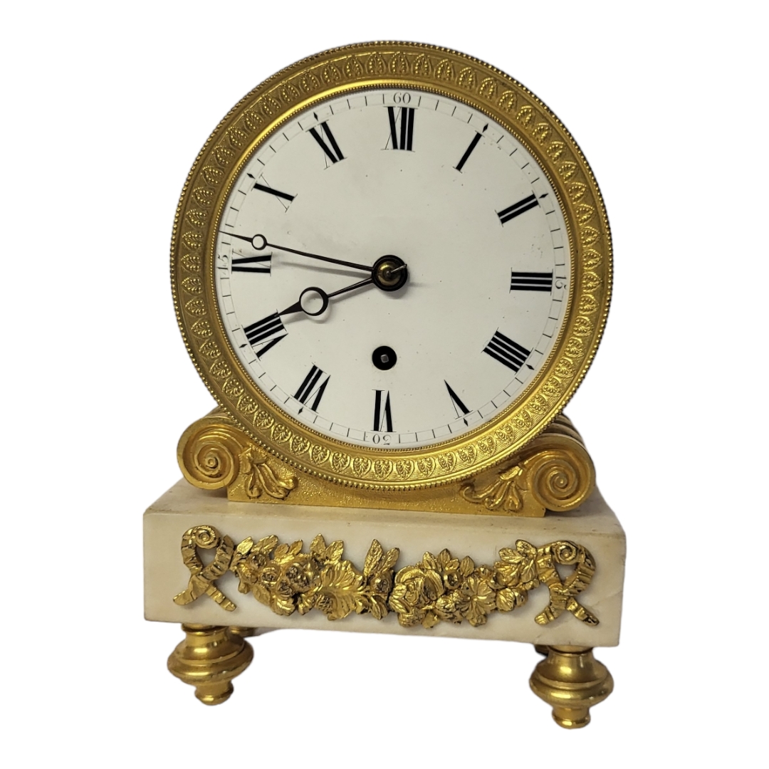 A 19TH CENTURY GILT BRONZE AND MARBLE TIMEPIECE CLOCK Barrel form case with Neoclassical