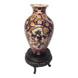 A 19TH CENTURY JAPANESE IMARI PORCELAIN OVOID VASE With central cartouche hand painted with bamboo