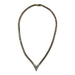 AN ITALIAN 14CT GOLD AND DIAMOND NECKLACE Having an arrangement of round cut diamonds in articulated