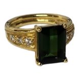 AN 18CT GOLD, DIAMOND AND GREEN TOURMALINE RING Rectangular cut stone with a diamond set