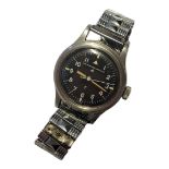 INTERNATIONAL WATCH COMPANY, A VINTAGE MILITARY GENT’S WRISTWATCH Having a black tone dial with