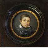 A 19TH CENTURY CIRCULAR MINIATURE PAINTING ON IVORY, PORTRAIT OF A YOUNG MAN In mahogany and