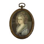 A 19TH CENTURY OVAL MINIATURE PAINTING ON IVORY, PORTRAIT OF A LADY WITH PEARL HEADDRESS