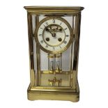 SAMUEL MARTI ET CIE, A FRENCH 19TH CENTURY GILT BRASS FOUR GLASS CLOCK Rectangular form with four