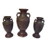 A LATE 19TH CENTURY JAPANESE EXPORT GARNITURE OF THREE BRONZE VASES, LATE MEIJI PERIOD, CIRCA 1900