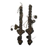 A PAIR OF VINTAGE CEREMONIAL INDONESIAN DAGGERS Made and decorated with cash coins. (length 31cm)