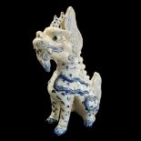 A CHINESE BLUE AND WHITE PORCELAIN TEMPLE DRAGON Standing pose with hand painted decoration. (approx
