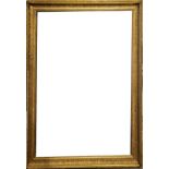 A SET OF FOUR EARLY 20TH CENTURY CARVED GILT RECTANGULAR PICTURE FRAMES With scrolled decoration,