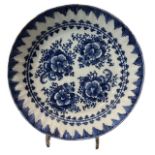 AN 18TH CENTURY DUTCH BLUE AND WHITE DELFTWARE BOWL Decorated with four flowerheads within a