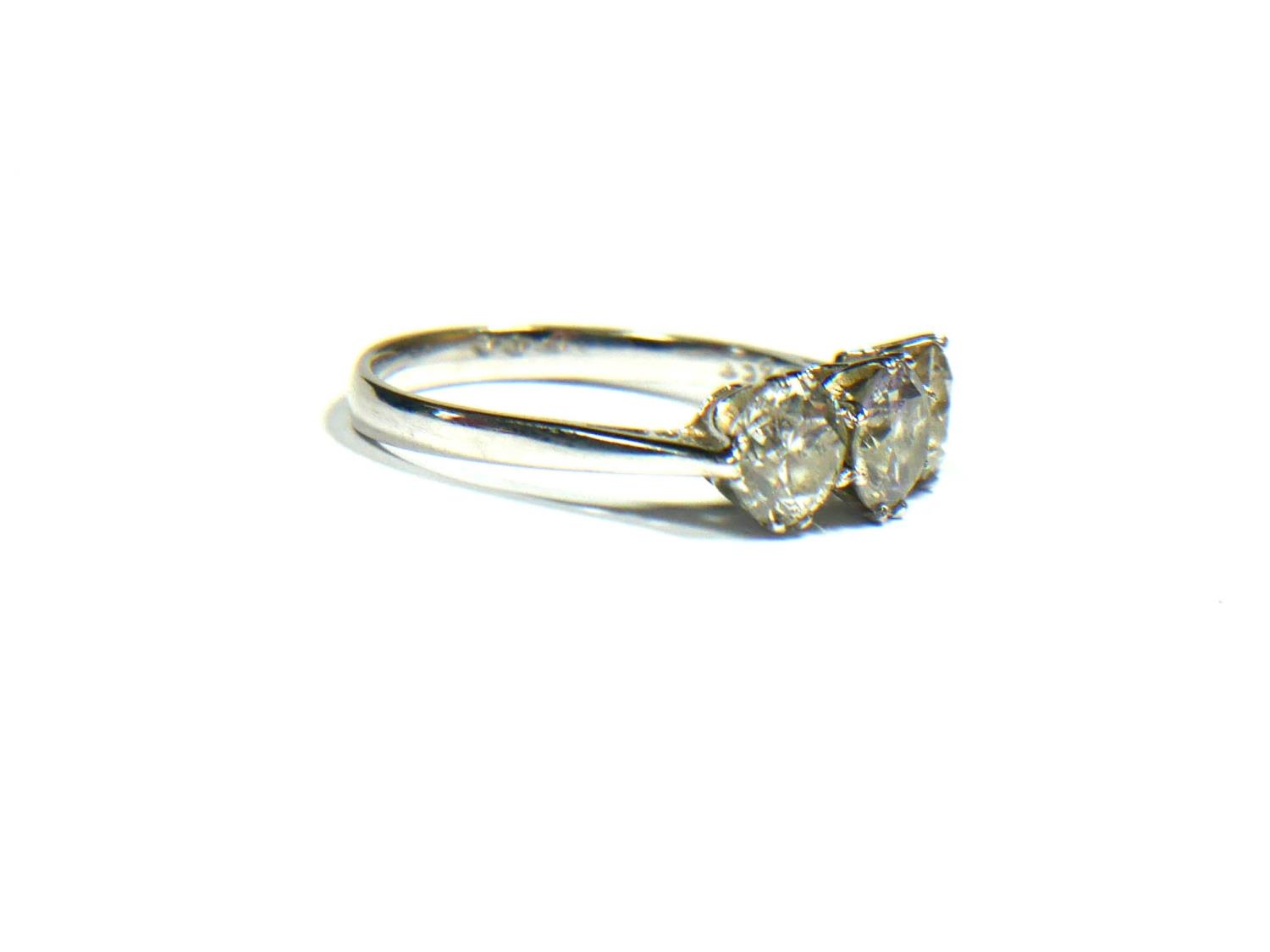 A 18CT WHITE GOLD AND THREE STONE DIAMOND RING, APPROX TOTAL CARAT WEIGHT 2.31CT Having graduated - Image 2 of 3