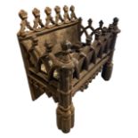 A 19TH CENTURY GOTHIC REVIVAL IRON FIRE BASKET With lancet arches and cluster column legs, (h 47cm x