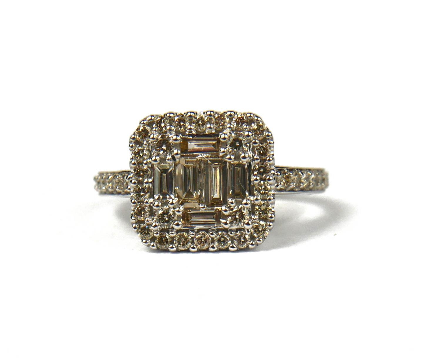 A 9CT WHITE GOLD, SQUARE SHAPED DIAMOND DRESS RING, set with baguette cut and round brilliant cut