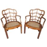 AN UNUSUAL PAIR OF GEORGE III CHIPPENDALE PERIOD LADDER BACK BERGERE OPEN ARMCHAIRS The laminated