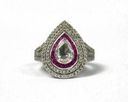 AN 18CT WHITE GOLD PEAR SHAPED ROSE CUT DIAMOND RING set with calibre cut rubies and round brilliant