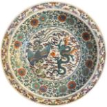 A LARGE 18TH/19TH CENTURY CHINESE DOUCAI 'DRAGON AND PHOENIX' CHARGER The center painted with a five