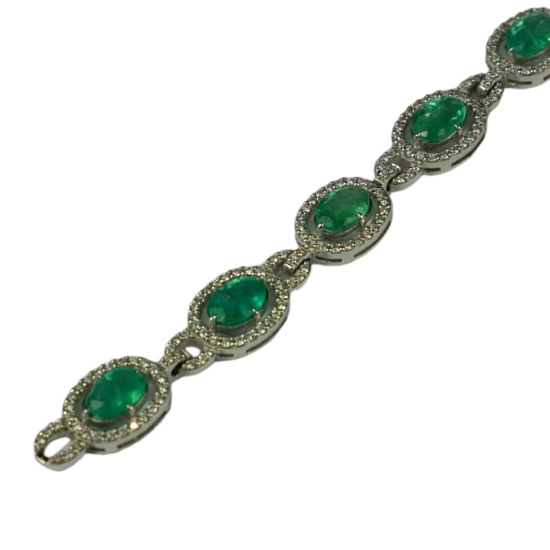 AN 18CT WHITE GOLD, EMERALD AND DIAMOND LINE BRACELET. (Approx. Oval emeralds 7.12ct total. Diamonds - Image 4 of 4