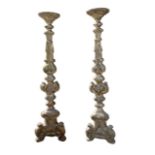 A PAIR OF 17TH/18TH CENTURY FLOORSTANDING ITALIAN BAROQUES Carved silver giltwood pricket stands