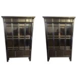 A PAIR OF LARGE SHAANXI ELM BLACK LACQUERED MARRIAGE CABINETS With panelled doors.