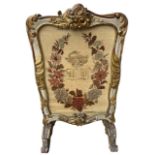 MANNER OF MOREL AND SEDDON, A 19TH CENTURY CARVED GILTWOOD PAINTED FIRE SCREEN Decorated with