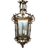 A 19TH CENTURY VICTORIAN GILT BRASS HALL LANTERN Decorated with shells and scrolling foliage. (