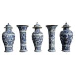 A CHINESE QINQ DYNASTY, BLUE AND WHITE GARNITURE COMPRISING OF THREE FLUTED BALUSTER VASES &