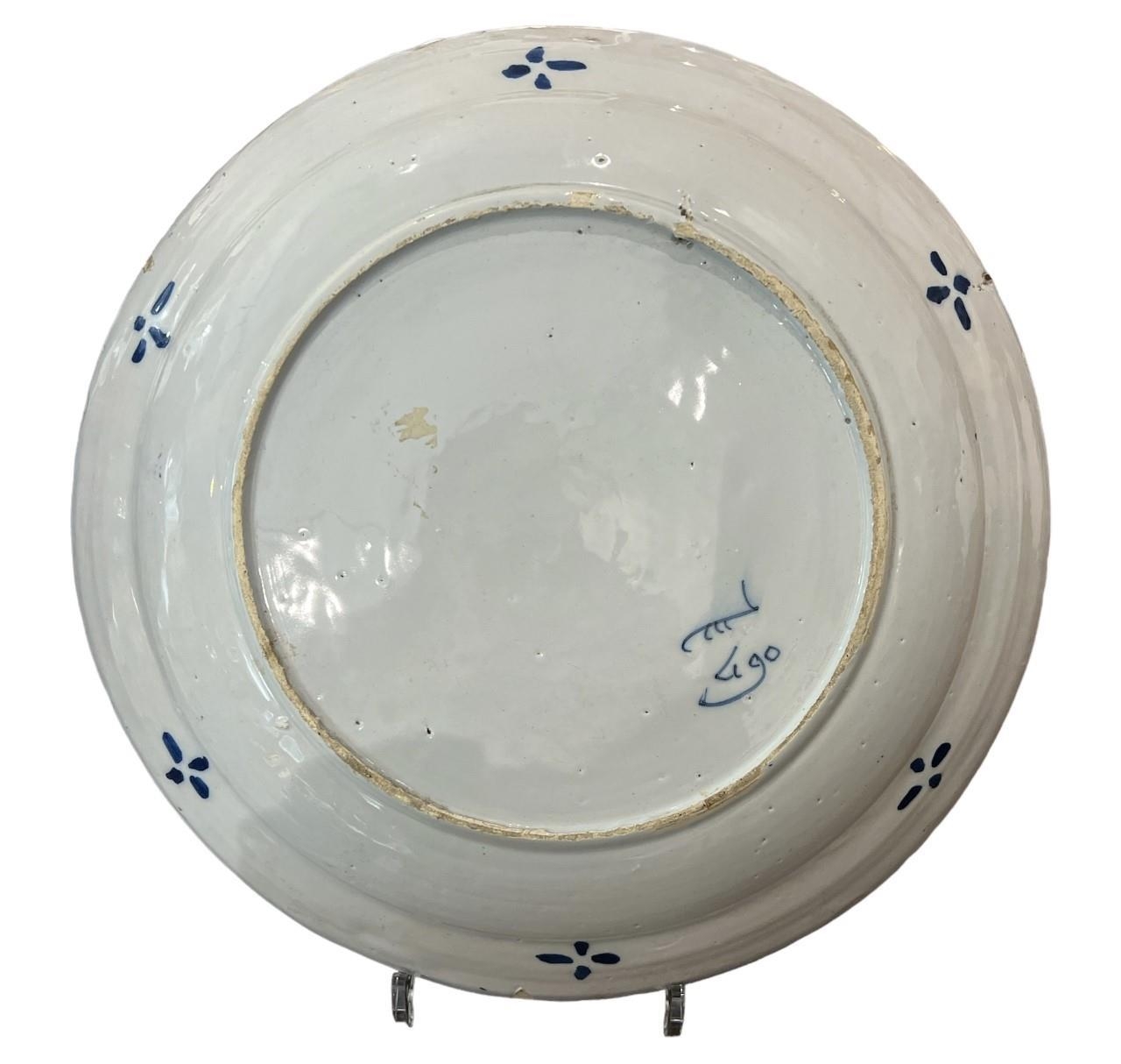 AN 18TH CENTURY DUTCH DELFT CHINOISERIE DISH Decorated in blue with flower vases on a terrace - Image 2 of 2