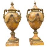 A PAIR OF 19TH CENTURY GILT BRONZE AND SIENNA MARBLE LIDDED URNS With flower finials and twin