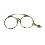 A 14CT WHITE GOLD FOLDING LORGNETTE Having chased and pierced decoration, lacking one lens. (76mm