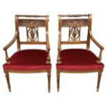 A PAIR OF REGENCY NEOCLASSICAL DESIGN OPEN ARMCHAIRS The carved backs decorated with urns and