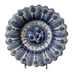 AN 18TH CENTURY DELFTWARE LOBED DISH, POSSIBLY GERMAN Having geometric floral border decorations. (