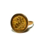 A 1914 GOLD HALF SOVEREIGN PLACED IN 9CT GOLD RING MOUNT. (UK ring size S, 7.2g)