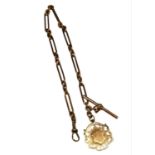 A VICTORIAN 9CT ROSE GOLD ALBERT CHAIN ATTACHED TO A 9CT GOLD POCKET WATCH FOB Having T Bar,