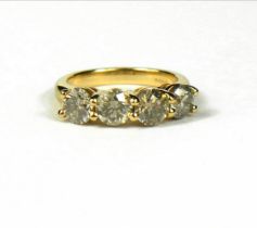 AN 18CT YELLOW GOLD FOUR STONE ROUND BRILLIANT CUT DIAMOND RING, with WGI certificate. (Diamonds 2.