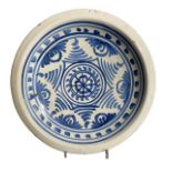 A 17TH CENTURY WHITE DELFTWARE PLATE, PROBABLY LONDON Painted in blue with a radiating