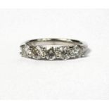 AN 18CT WHITE GOLD FIVE STONE DIAMOND RING. (Approx diamonds 1.09ct)