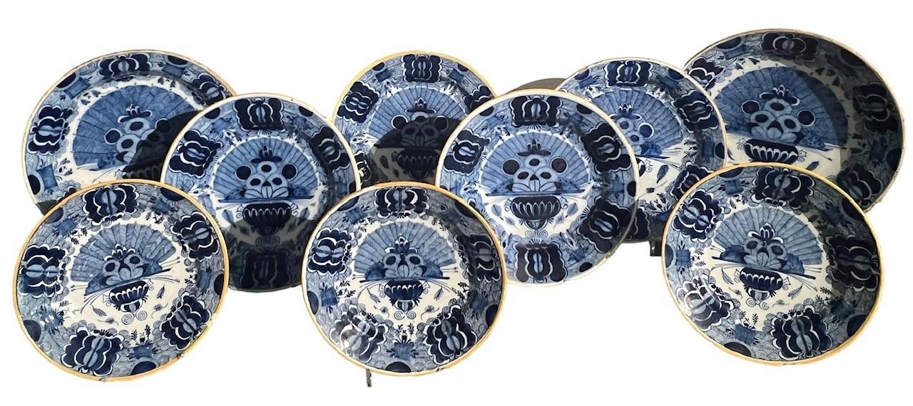 NINE 18TH CENTURY DUTCH DELFT BLUE AND WHITE PEACOCK CHARGERS/DISHES, Including a large De