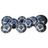 NINE 18TH CENTURY DUTCH DELFT BLUE AND WHITE PEACOCK CHARGERS/DISHES, Including a large De