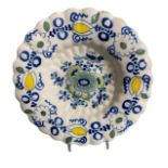 A LATE 17TH CENTURY DELFTWARE LOBED FAIENCE DISH, POSSIBLY LE CROISIC Painted in blue and yellow