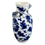 A CHINESE BLUE AND WHITE VASE Decorated with two dragons chasing the pearl of wisdom amongst