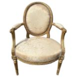 A FINE GEORGE III CHIPPENDALE PERIOD CARVED GILTWOOD OPEN ARMCHAIR The oval padded back above