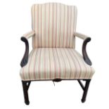 A GEORGE II DESIGN GOTHIC REVIVAL CARVED MAHOGANY GAINSBOROUGH ARMCHAIR With shaped padded backs
