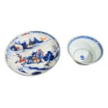 A CHINESE QIANLONG STYLE BLUE, WHITE AND ORANGE SAUCER Together with a blue and white cup, saucer