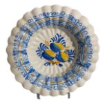 A LATE 17TH CENTURY DELFTWARE LOBED FAIENCE DISH, PERHAPS LE CROISIC Having blue and yellow